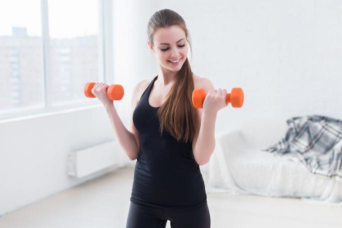 A set of exercises on exercise machines in the gym for women - creating a training program